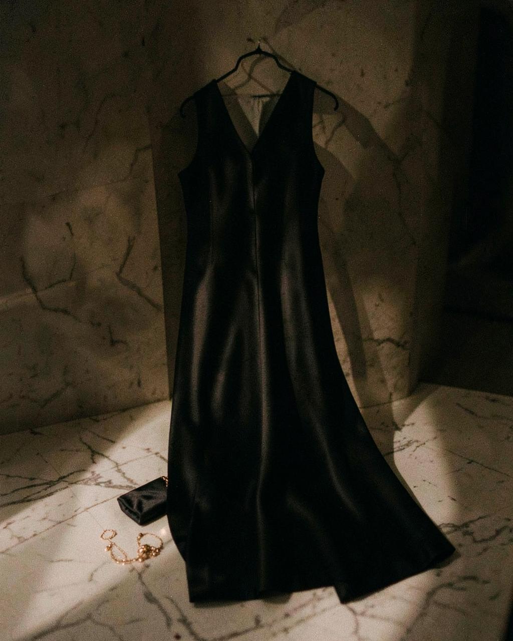 Black tie wedding guest dressing in deep evening tones