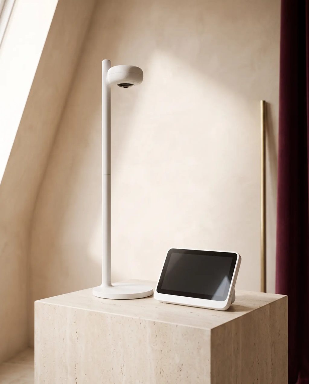 Editorial inspiration: a white baby monitor camera on a floor stand with a screen unit