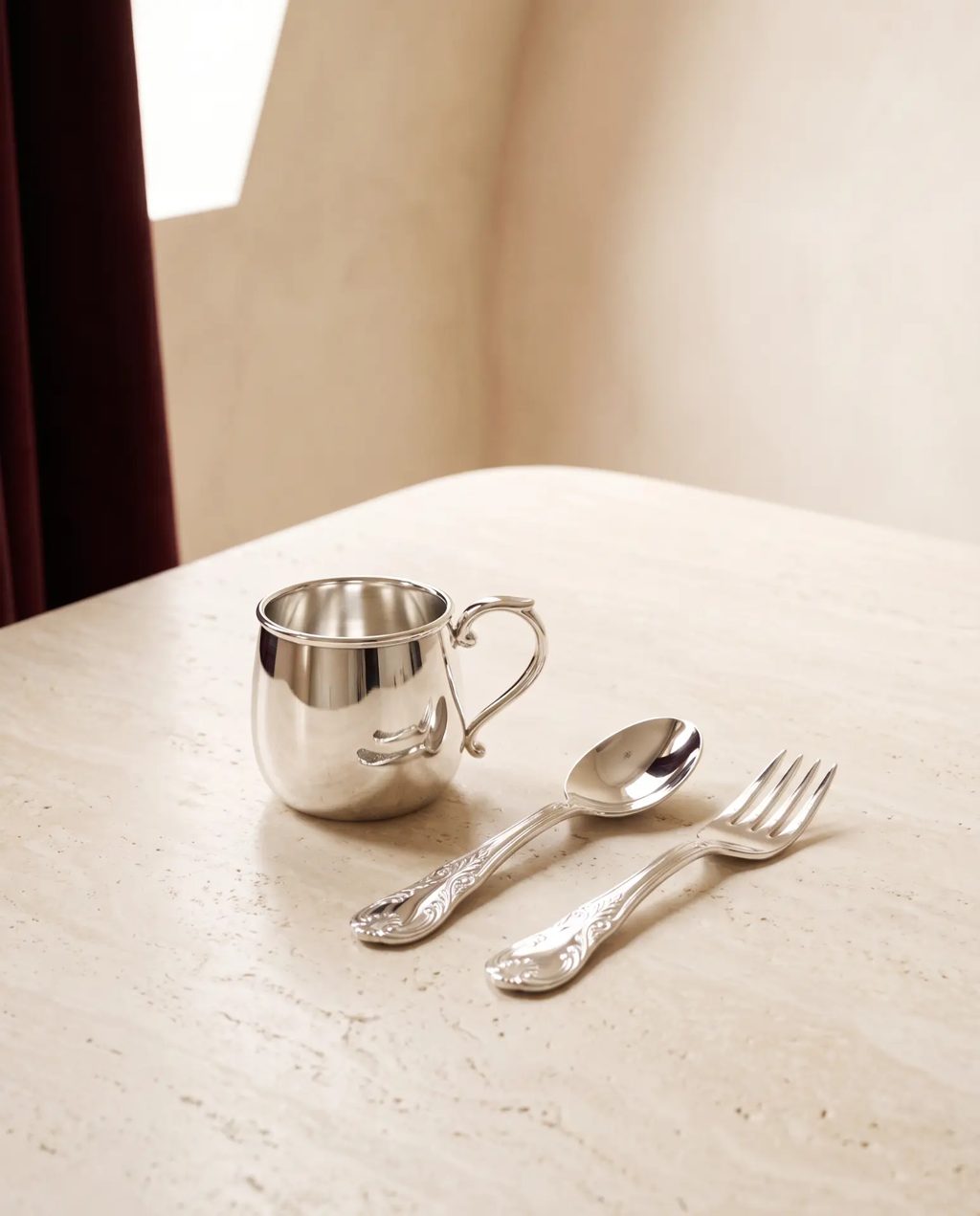 Editorial inspiration: a silver baby cup with matching spoon and fork