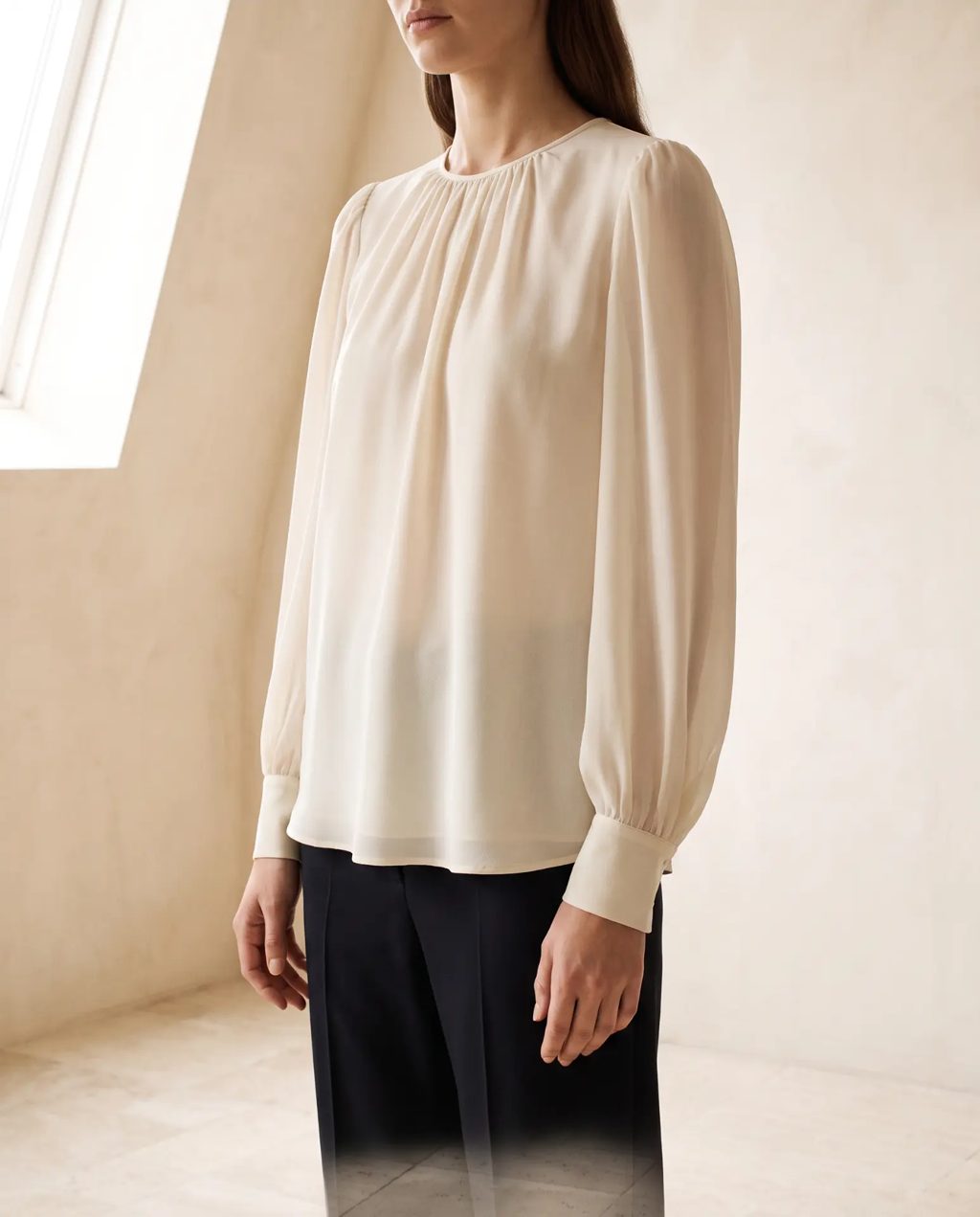 Editorial inspiration: a cream long-sleeve gathered blouse