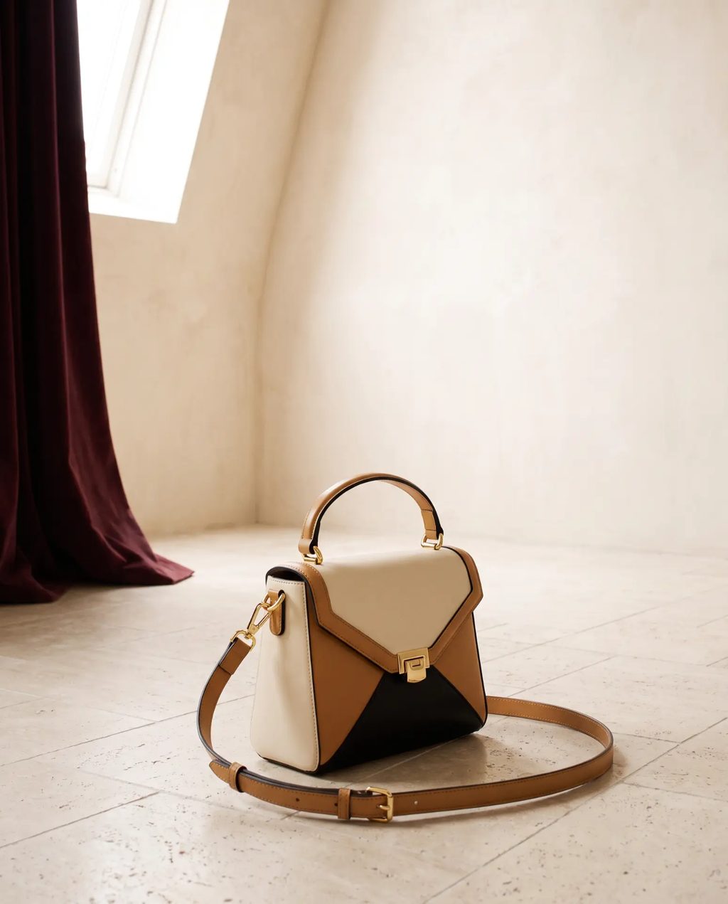 Editorial inspiration: a cream, tan and black color-block top-handle crossbody bag