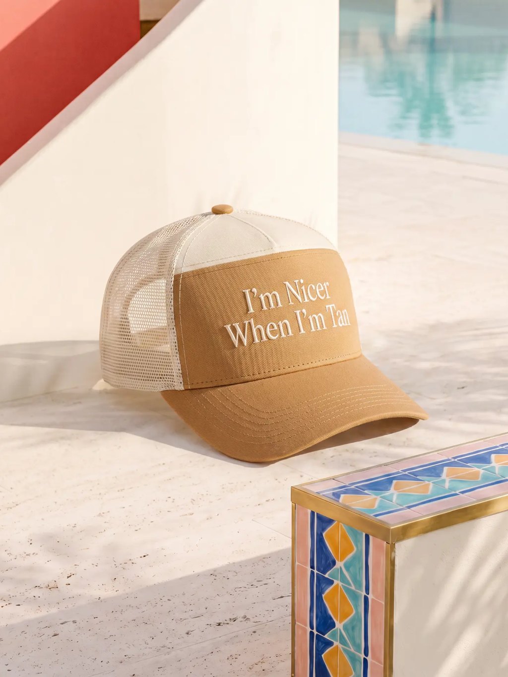 Editorial inspiration for an embroidered tan trucker hat