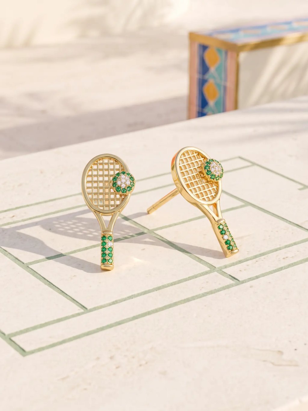 Editorial inspiration for gold tennis racket stud earrings