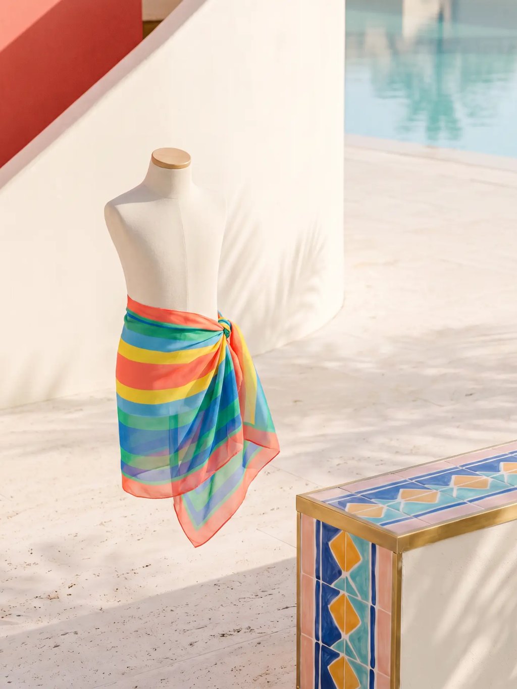 Editorial inspiration for a mini rainbow stripe sarong