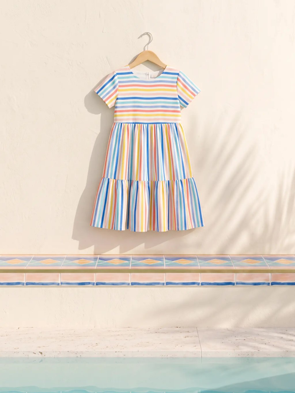 Editorial inspiration for a kids confetti stripe tiered dress