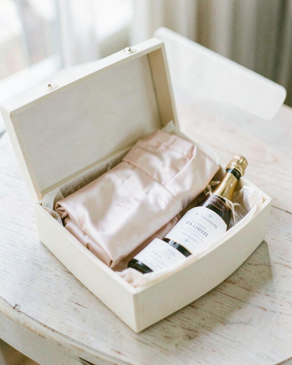 Bridesmaid proposal box contents arranged on a neutral surface
